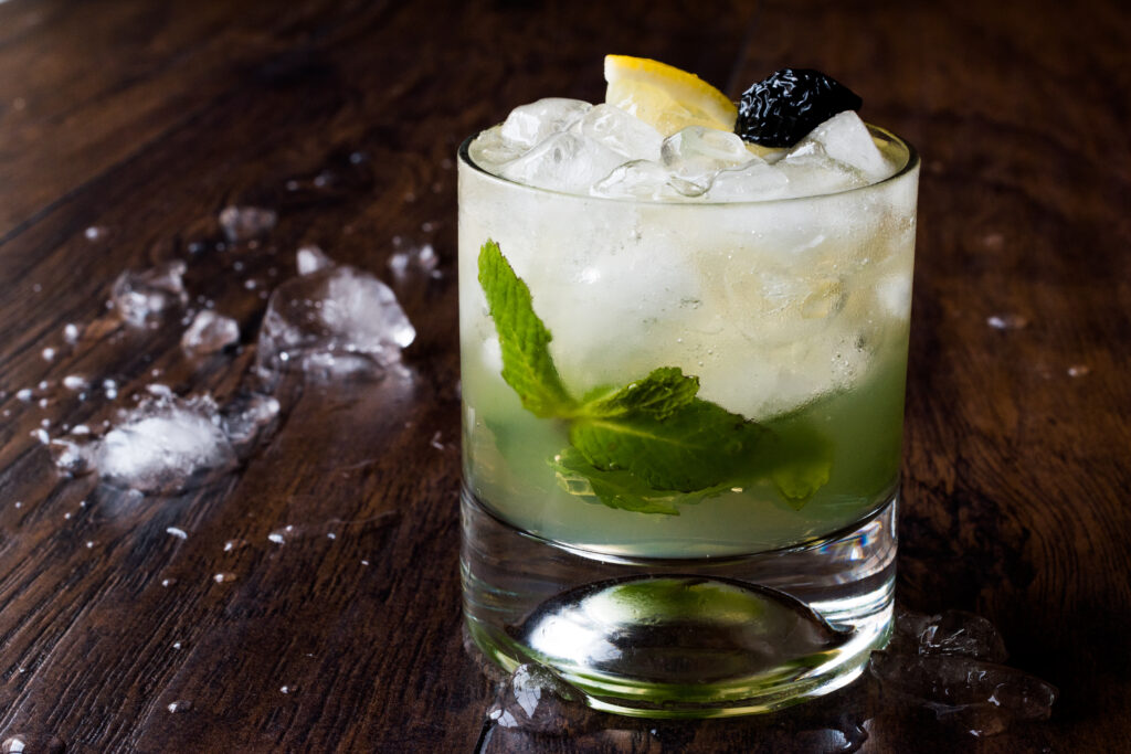 An image of a Bourbon Smash. A refreshing cocktail for the summer. Mixology is a hobby for some people in the over 40 age group.