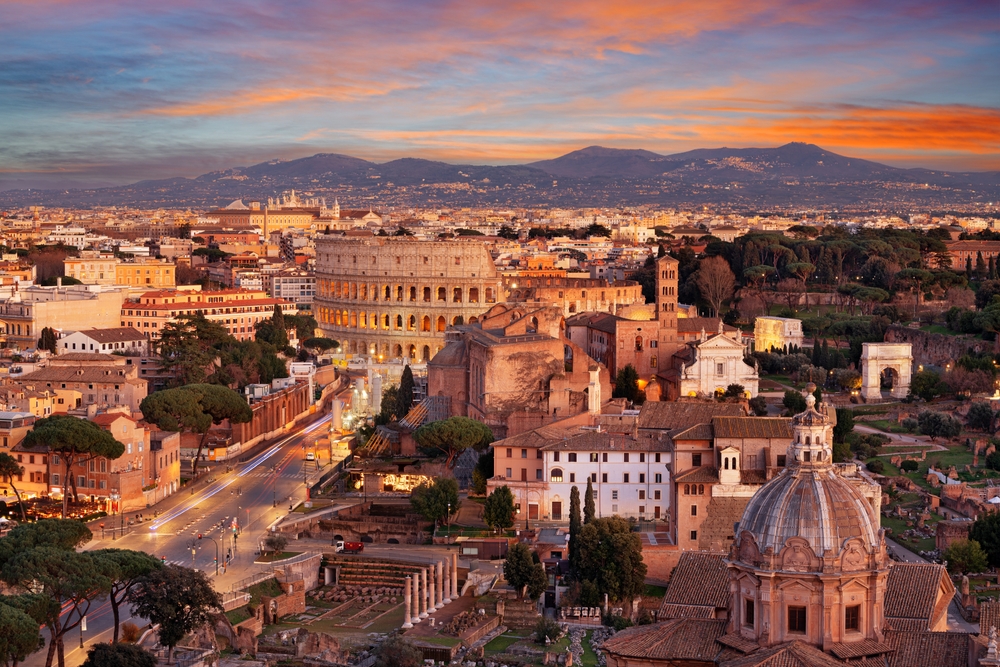 Image of Rome, Italy at sunset with the colosseum.