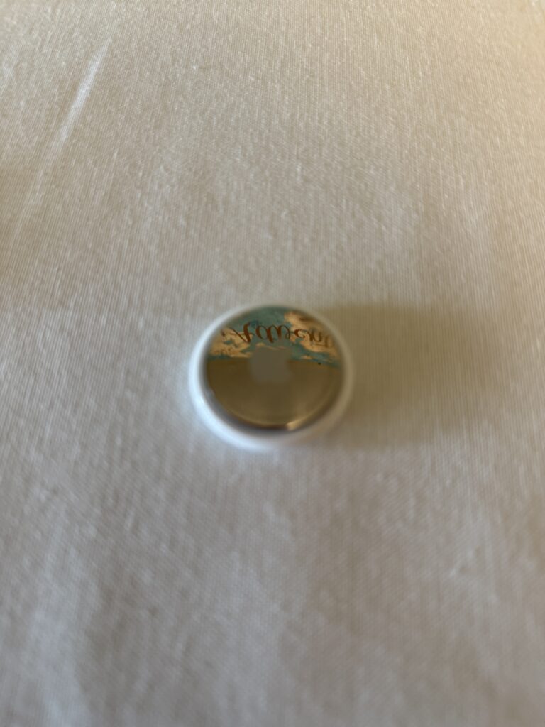 Apple AirTag attached to bag for tracking location during travel”