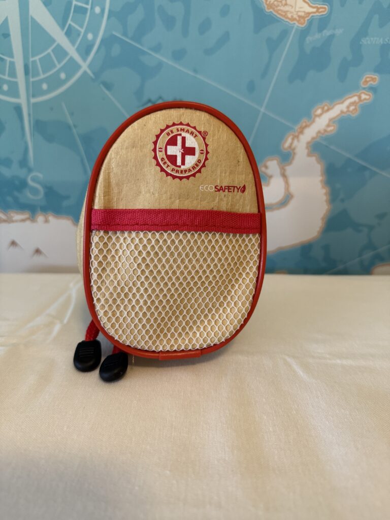 Thrive mini first aid kit in red, waterproof pouch with essential medical items for emergencies