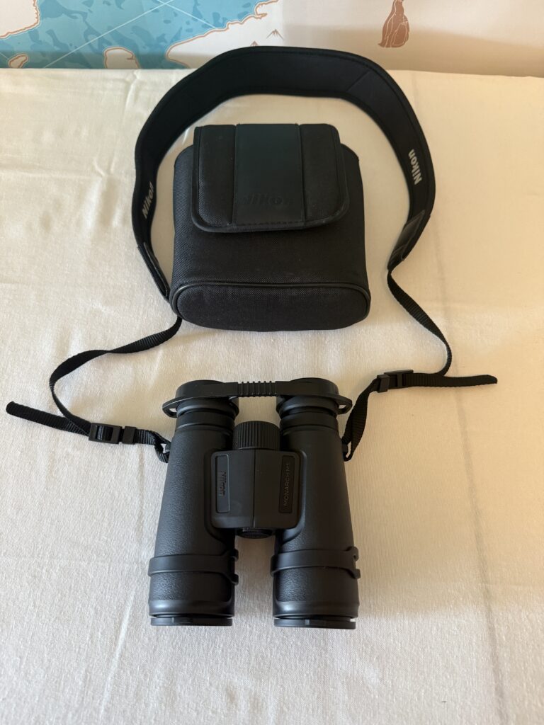 Nikon Monarch M5 binoculars with rugged black rubber coating and included lens caps